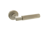 Quality image of Millhouse Brass Cartwright Knurled Lever Door Handle on Round Rose - Satin Nickel | Sku. mhr200sn | available from Trade Door Handles.
