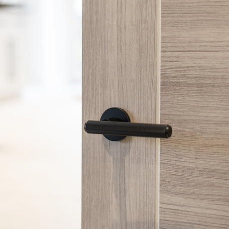 Quality image of Millhouse Brass Stephenson Knurled Lever Door Handle on 5mm Slimline Round Rose - Matt Black | Sku. mhsr250mb | available from Trade Door Handles.