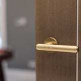 Quality image of Millhouse Brass Stephenson Knurled Lever Door Handle on 5mm Slimline Round Rose - Satin Brass | Sku. mhsr250sb | available from Trade Door Handles.
