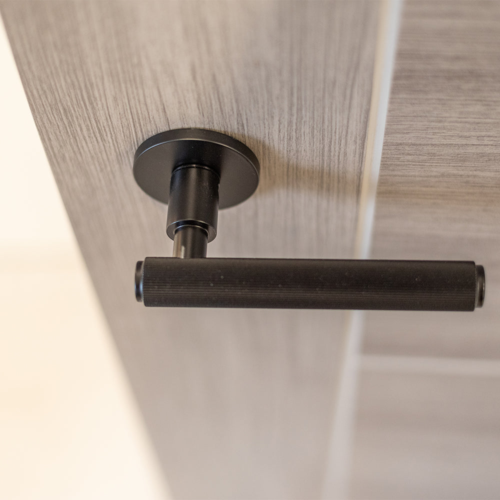Quality image of Millhouse Brass Stephenson Knurled Lever Door Handle on 5mm Slimline Round Rose - Urban Dark Bronze | Sku. mhsr250udb | available from Trade Door Handles.
