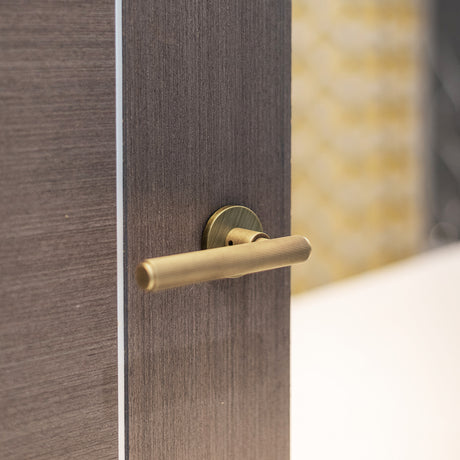 Quality image of Millhouse Brass Stephenson Knurled Lever Door Handle on 5mm Slimline Round Rose - Yester Bronze | Sku. mhsr250yb | available from Trade Door Handles.
