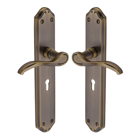 High quality image of the Heritage Brass Door Handle Lever Lock Verona Long Design Antique Brass Finish
 | Sku. mm824-at | Discounted prices available from Trade Door Handles
