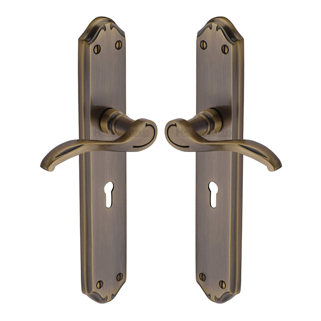 High quality image of the Heritage Brass Door Handle Lever Lock Verona Long Design Antique Brass Finish
 | Sku. mm824-at | Discounted prices available from Trade Door Handles