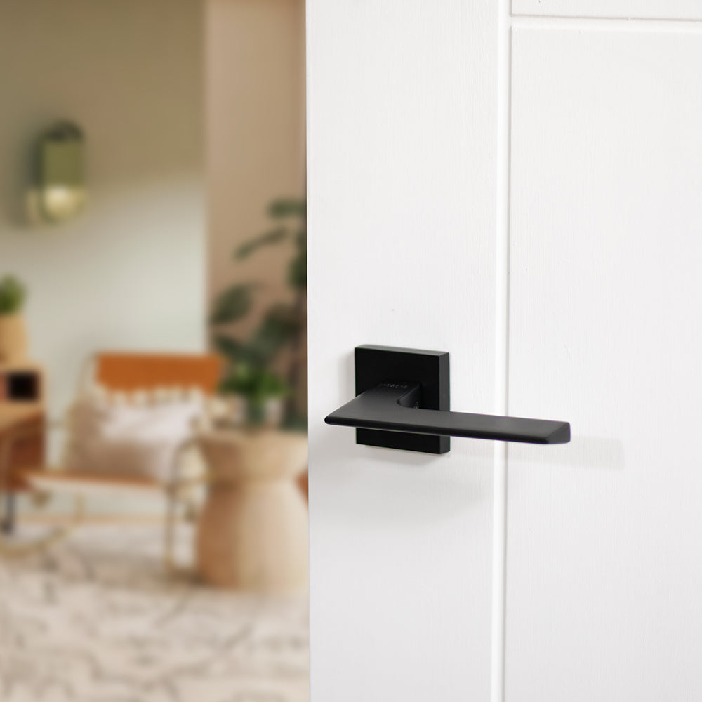 Quality image of Oro & Oro Unica Lever Door Handle on Square Rose - Matt Black | Sku. o6515emb | available from Trade Door Handles.