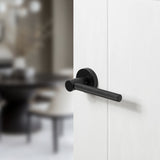 Quality image of Oro & Oro Stradi Lever Door Handle on Round Rose - Matt Black | Sku. o10917emb | available from Trade Door Handles.