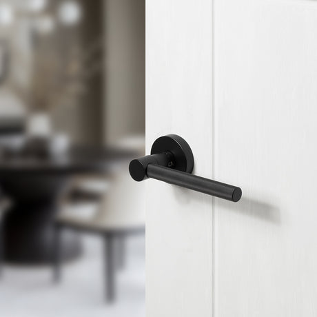 Quality image of Oro & Oro Stradi Lever Door Handle on Round Rose - Matt Black | Sku. o10917emb | available from Trade Door Handles.
