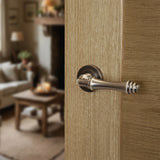 Quality image of Old English Durham Lever Door Handle on Round Rose - Matt Gun Metal | Sku. oe127mbn | available from Trade Door Handles.