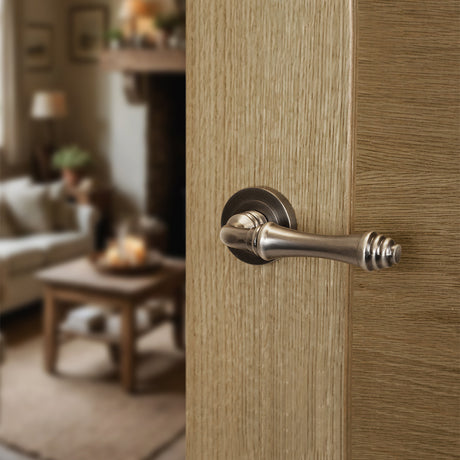 Quality image of Old English Durham Lever Door Handle on Round Rose - Matt Gun Metal | Sku. oe127mbn | available from Trade Door Handles.