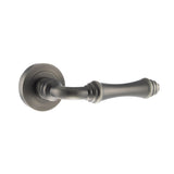 Quality image of Old English Durham Lever Door Handle on Round Rose - Matt Gun Metal | Sku. oe127mbn | available from Trade Door Handles.
