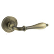 Quality image of Old English Wrexham Lever Door Handle on Round Rose - Matt Antique Brass | Sku. oe142mab | available from Trade Door Handles.