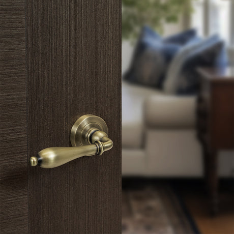Quality image of Old English Wrexham Lever Door Handle on Round Rose - Matt Antique Brass | Sku. oe142mab | available from Trade Door Handles.