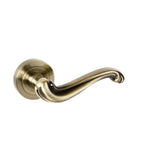 Quality image of Old English Colchester Lever Door Handle on Round Rose - Antique Brass | Sku. oe177ab | available from Trade Door Handles.