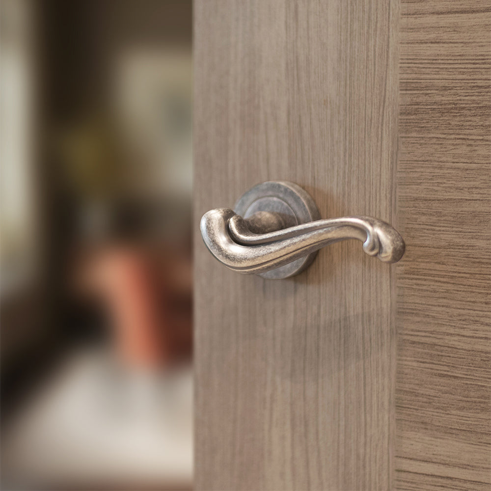 Quality image of Old English Colchester Lever Door Handle on Round Rose - Distressed Silver | Sku. oe177ds | available from Trade Door Handles.