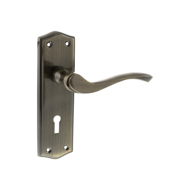 Quality image of Old English Warwick Key Lever Door Handle on Backplate - Antique Brass | Sku. oe178kab | available from Trade Door Handles.