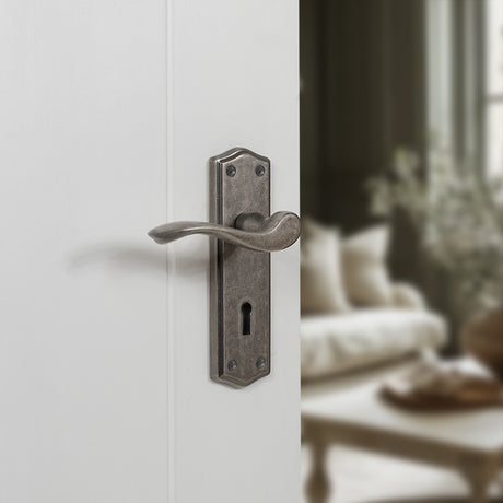 Quality image of Old English Warwick Key Lever Door Handle on Backplate - Distressed Silver | Sku. oe178kds | available from Trade Door Handles.