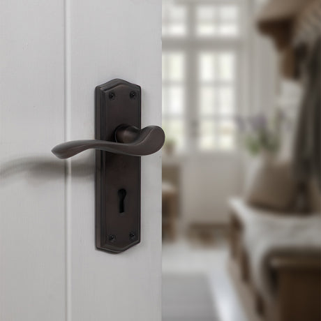 Quality image of Old English Warwick Key Lever Door Handle on Backplate - Urban Dark Bronze | Sku. oe178kudb | available from Trade Door Handles.