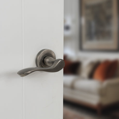 Quality image of Old English Warwick Lever Door Handle on Round Rose - Matt Gun Metal | Sku. oe178mbn | available from Trade Door Handles.