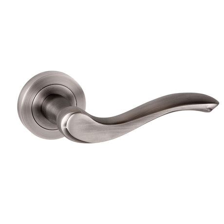 Quality image of Old English Warwick Lever Door Handle on Round Rose - Matt Gun Metal | Sku. oe178mbn | available from Trade Door Handles.