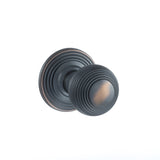 Quality image of Old English Ripon Solid Brass Reeded Mortice Knob on Concealed Fix Rose - Antique Copper | Sku. oe50rmkac | available from Trade Door Handles.