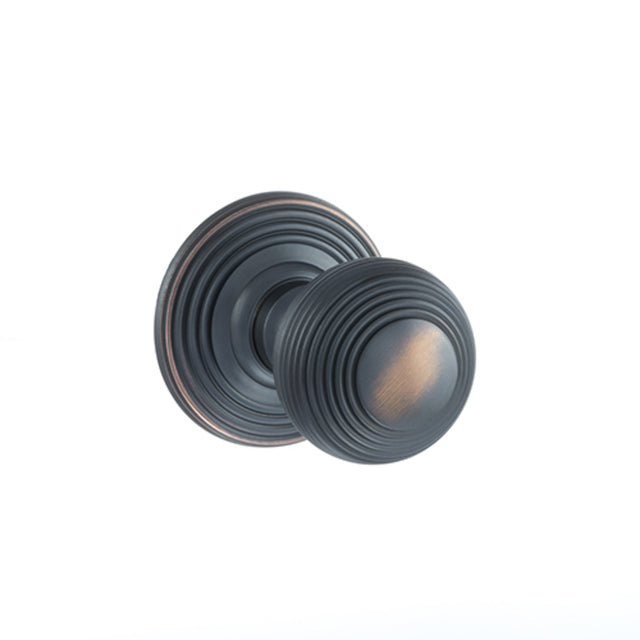 Quality image of Old English Ripon Solid Brass Reeded Mortice Knob on Concealed Fix Rose - Antique Copper | Sku. oe50rmkac | available from Trade Door Handles.