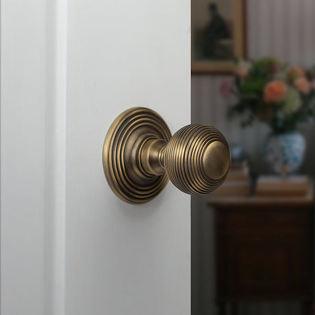 Quality image of Old English Ripon Solid Brass Reeded Mortice Knob on Concealed Fix Rose - Matt Antique Brass | Sku. oe50rmkmab | available from Trade Door Handles.