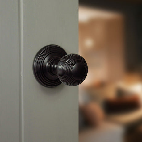 Quality image of Old English Ripon Solid Brass Reeded Mortice Knob on Concealed Fix Rose - Matt Black | Sku. oe50rmkmb | available from Trade Door Handles.
