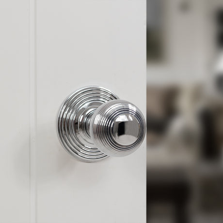 Quality image of Old English Ripon Solid Brass Reeded Mortice Knob on Concealed Fix Rose - Polished Chrome | Sku. oe50rmkpc | available from Trade Door Handles.