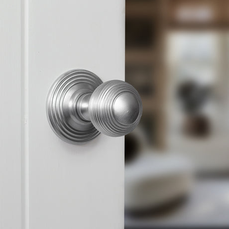 Quality image of Old English Ripon Solid Brass Reeded Mortice Knob on Concealed Fix Rose - Satin Chrome | Sku. oe50rmksc | available from Trade Door Handles.