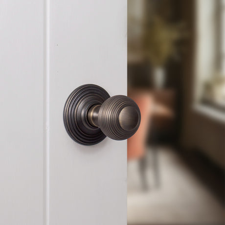 Quality image of Old English Ripon Solid Brass Reeded Mortice Knob on Concealed Fix Rose - Urban Bronze | Sku. oe50rmkub | available from Trade Door Handles.