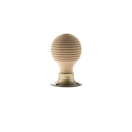 Quality image of Old English Bridlington Wood Reeded Beehive Door Knob on Face Fix Rose - Antique Brass | Sku. oe57rmkab | available from Trade Door Handles.