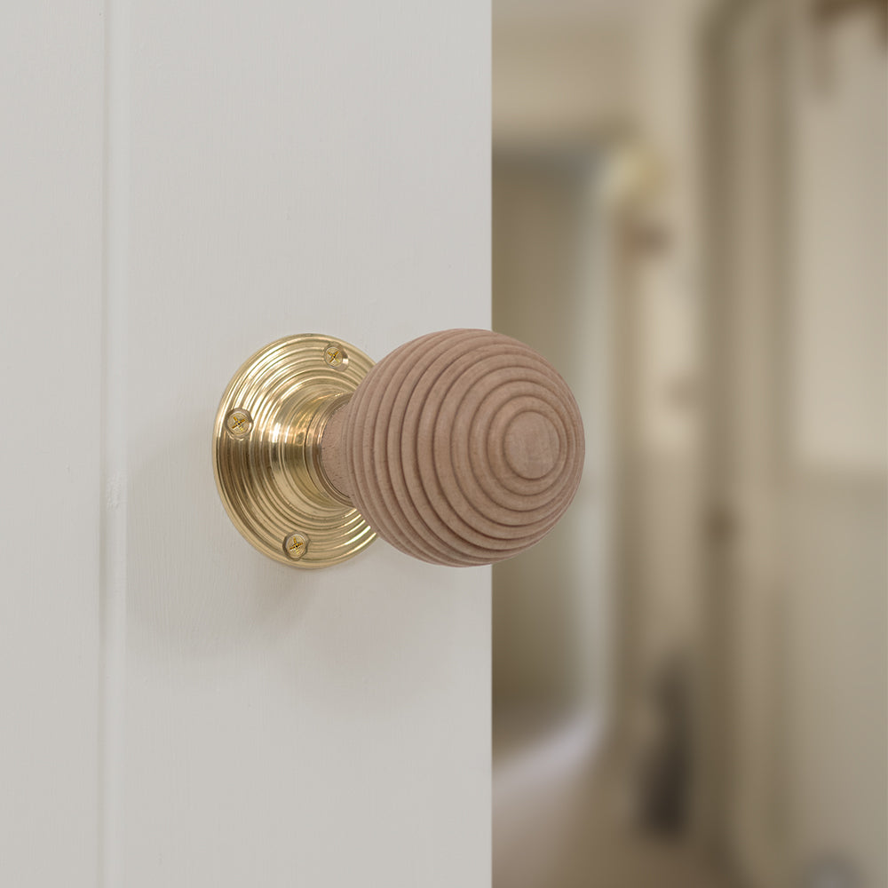 Quality image of Old English Bridlington Wood Reeded Beehive Door Knob on Face Fix Rose - Polished Brass | Sku. oe57rmkpb | available from Trade Door Handles.