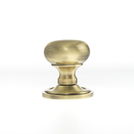 Quality image of Old English Harrogate Solid Brass Mushroom Mortice Knob on Concealed Fix Rose - Antique Brass | Sku. oe58mmkab | available from Trade Door Handles.