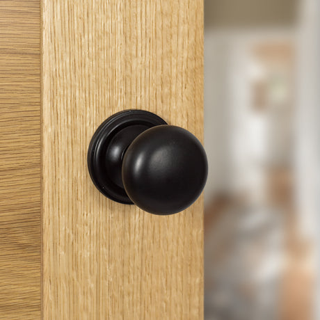 Quality image of Old English Harrogate Solid Brass Mushroom Mortice Knob on Concealed Fix Rose - Matt Black | Sku. oe58mmkmb | available from Trade Door Handles.