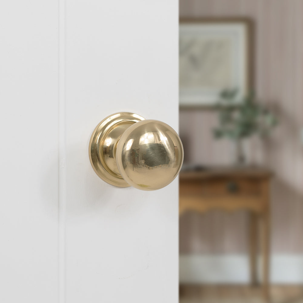 Quality image of Old English Harrogate Solid Brass Mushroom Mortice Knob on Concealed Fix Rose - Polished Brass | Sku. oe58mmkpb | available from Trade Door Handles.