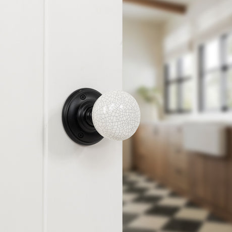 Quality image of Old English Skipton Porcelain White Crackle Door Knob on Face Fix Rose - Matt Black | Sku. oe59cmkwhmb | available from Trade Door Handles.