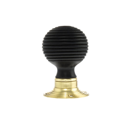 Quality image of Old English Whitby Ebony Wood Reeded Beehive Mortice Knob on Face Fix Rose - Polished Brass | Sku. oe60rremkpb | available from Trade Door Handles.