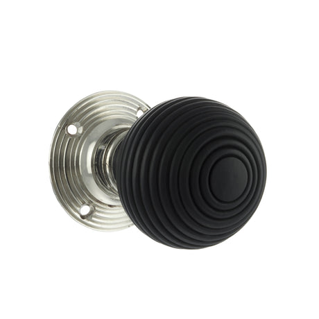 Quality image of Old English Whitby Ebony Wood Reeded Beehive Mortice Knob on Face Fix Rose - Polished Nickel | Sku. oe60rremkpn | available from Trade Door Handles.