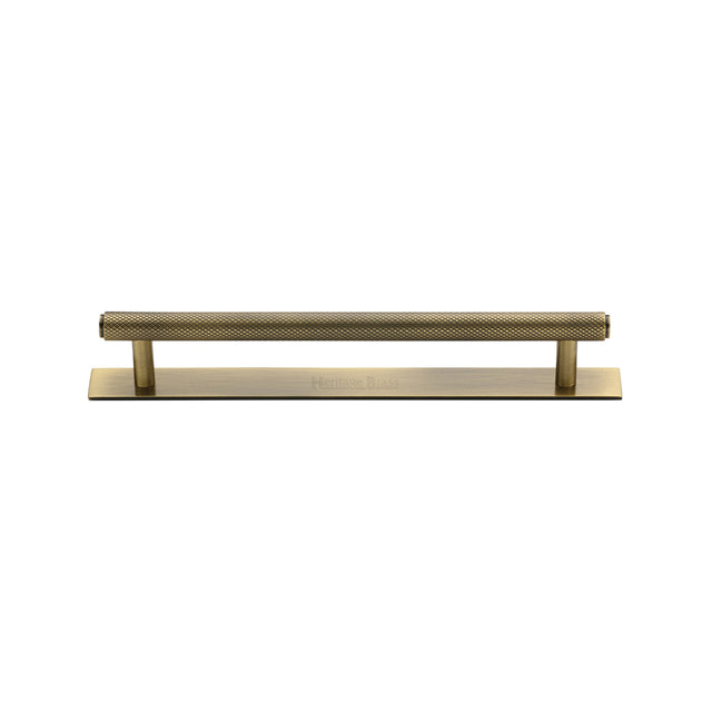 High quality image of the Heritage Brass Cabinet Pull Knurled Design with Plate 128mm CTC Antique Brass Finish | Sku. pl4458-128-at | Discounted prices available from Trade Door Handles