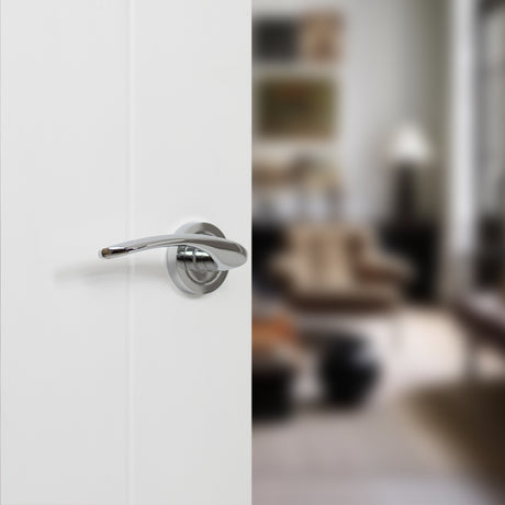 Quality image of STATUS Arizona Lever Door Handle on Round Rose - Polished Chrome | Sku. s22rpc | available from Trade Door Handles.