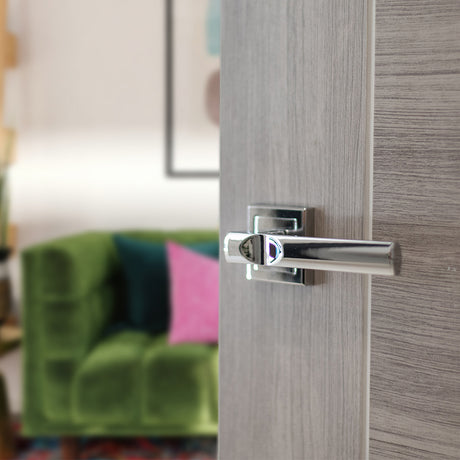 Quality image of STATUS Kansas Lever Door Handle on Square Rose - Polished Chrome | Sku. s24spc | available from Trade Door Handles.