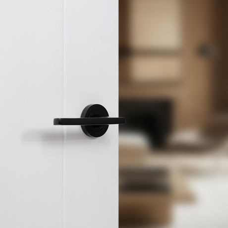Quality image of STATUS Alaska Lever Door Handle on Round Rose - Matt Black | Sku. s26rmb | available from Trade Door Handles.