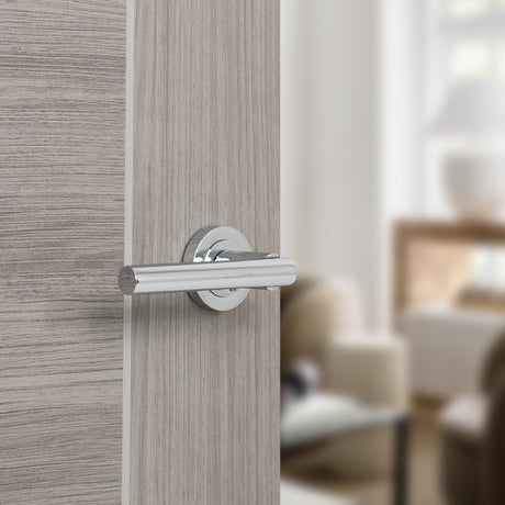 Quality image of STATUS Nebraska Lever Door Handle on Round Rose - Polished Chrome | Sku. s28rpc | available from Trade Door Handles.