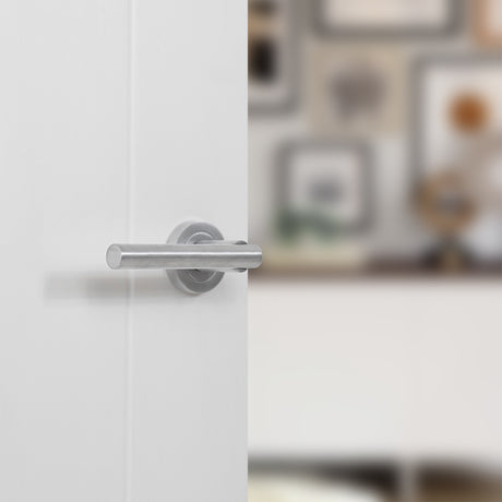 Quality image of STATUS Nebraska Lever Door Handle on Round Rose - Satin Chrome | Sku. s28rsc | available from Trade Door Handles.