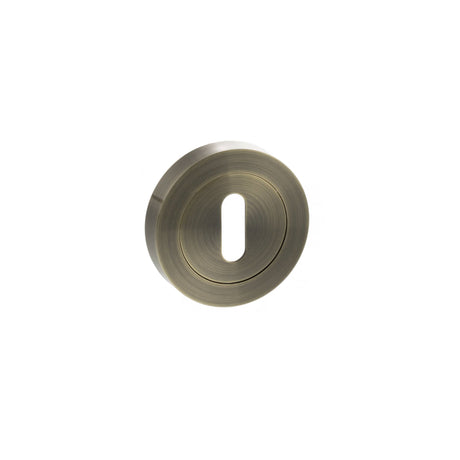Quality image of STATUS Key Escutcheons on Round Rose - Antique Brass | Sku. s2esckrab | available from Trade Door Handles.