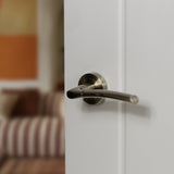 Quality image of STATUS Indiana Lever Door Handle on Round Rose - Antique Brass | Sku. s33rab | available from Trade Door Handles.
