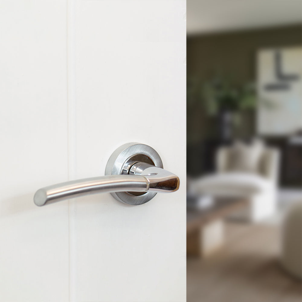 Quality image of STATUS Indiana Lever Door Handle on Round Rose - Satin Chrome/Polished Chrome | Sku. s33rscpc | available from Trade Door Handles.