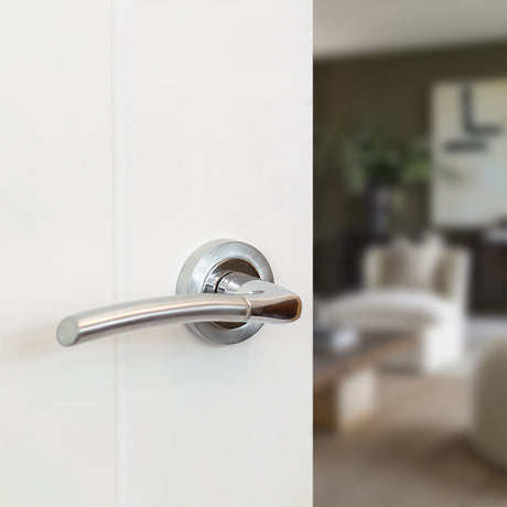Quality image of STATUS Indiana Lever Door Handle on Round Rose - Satin Chrome/Polished Chrome | Sku. s33rscpc | available from Trade Door Handles.