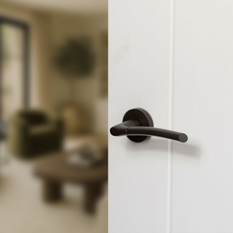 Quality image of STATUS Indiana Lever Door Handle on Round Rose - Urban Dark Bronze | Sku. s33rudb | available from Trade Door Handles.