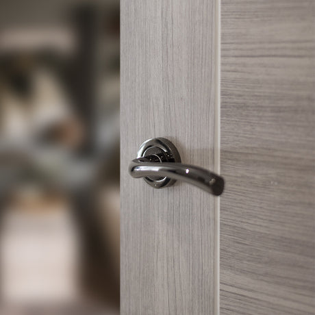 Quality image of STATUS Texas Lever Door Handle on Round Rose - Black Nickel | Sku. s35rbn | available from Trade Door Handles.