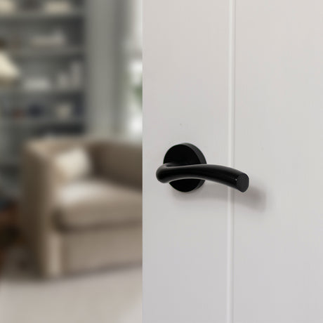 Quality image of STATUS Texas Lever Door Handle on Round Rose - Matt Black | Sku. s35rmb | available from Trade Door Handles.
